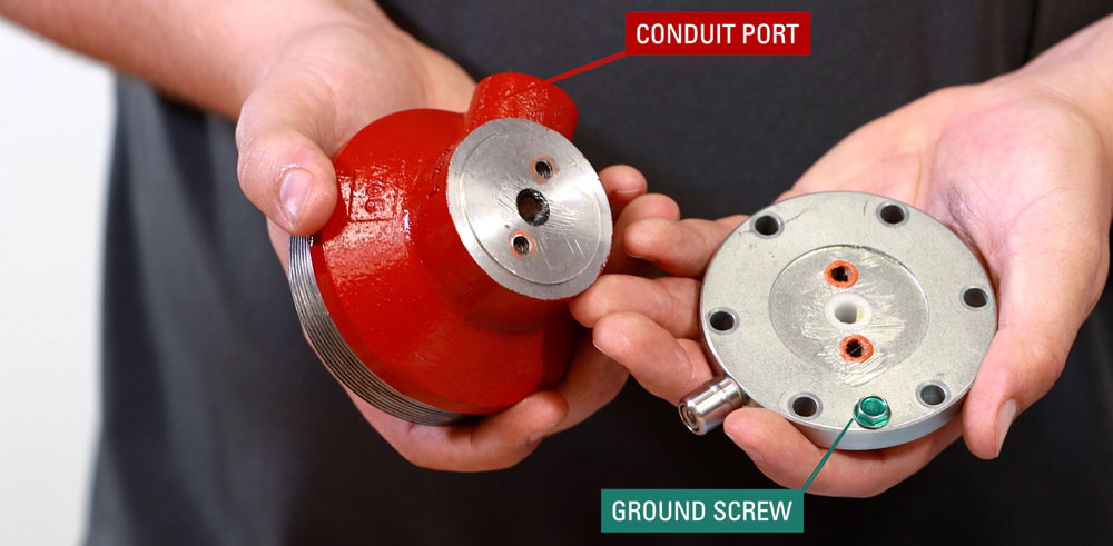 align the conduit port and ground screw