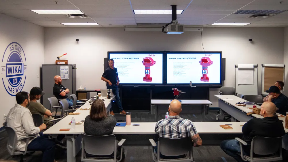 Kimray Team Member Teaching Customers at Their Location