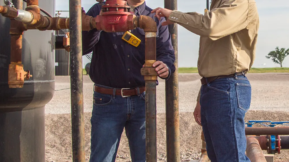 Breck and Brian examining a Back Pressure Regulator