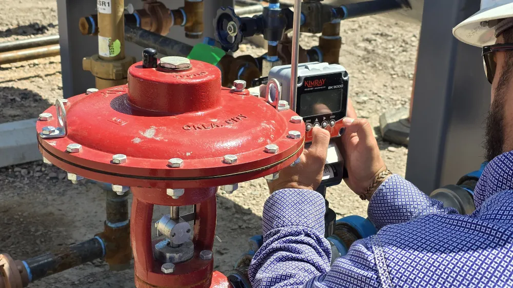 Kimray Team Member Working on a Flow Meter