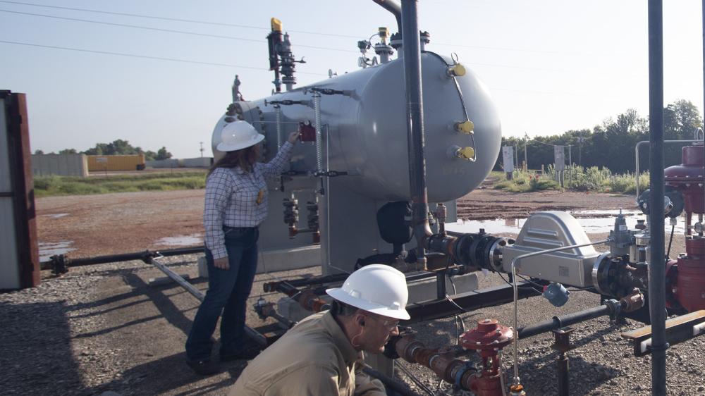 Kimray Team Members Inspecting Well Site