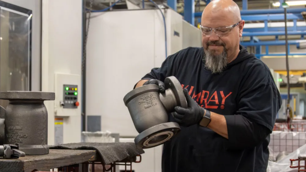 Kimray Team Member Working on a Product