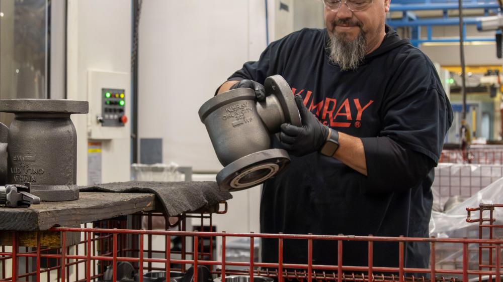 Kimray Team Member Working on Product