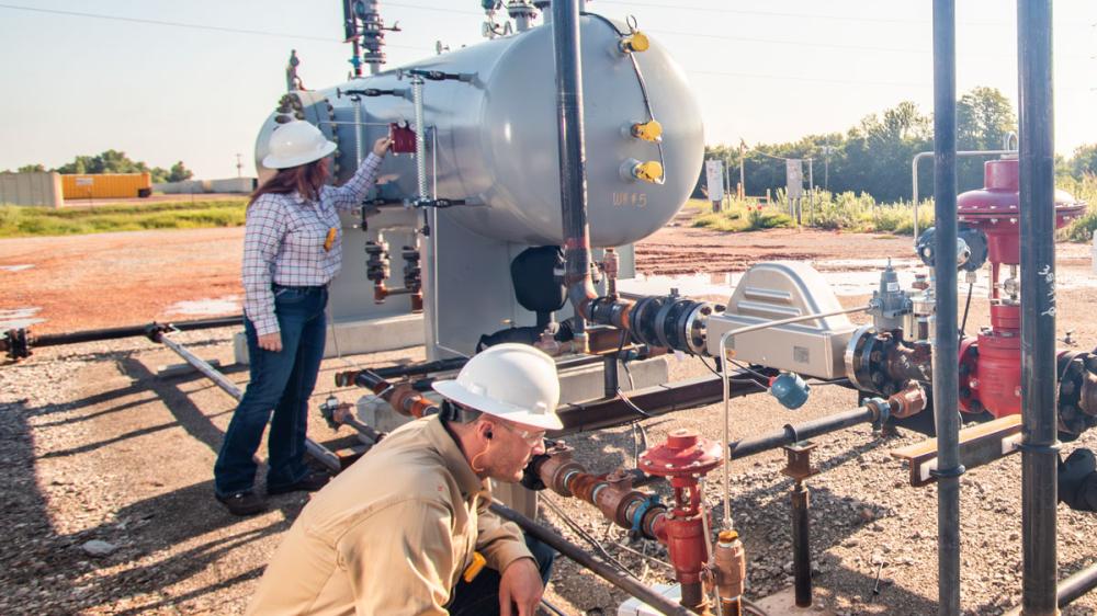 Kimray Team Members Inspecting Well Site