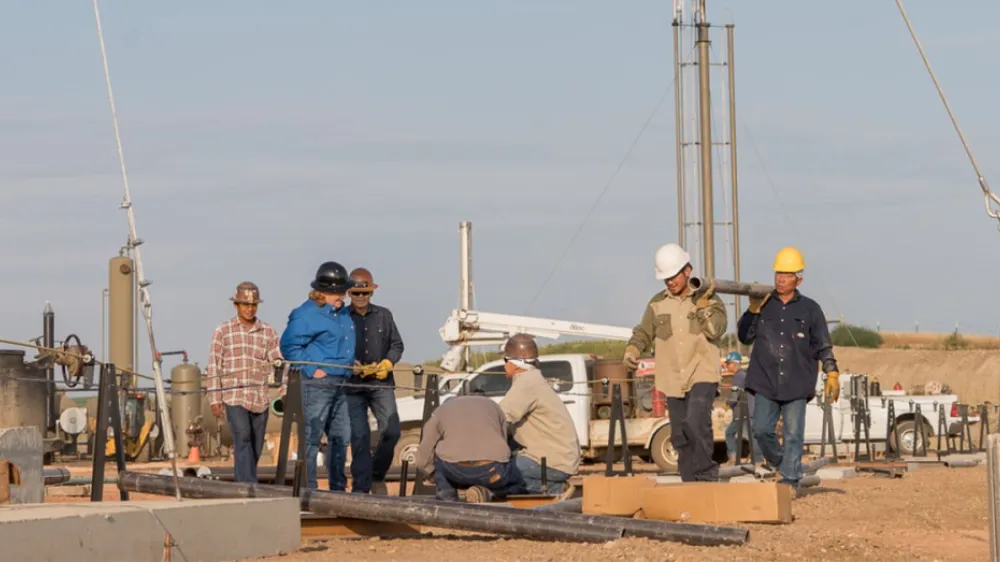 Kimray Field Workers at a Oil Well Site