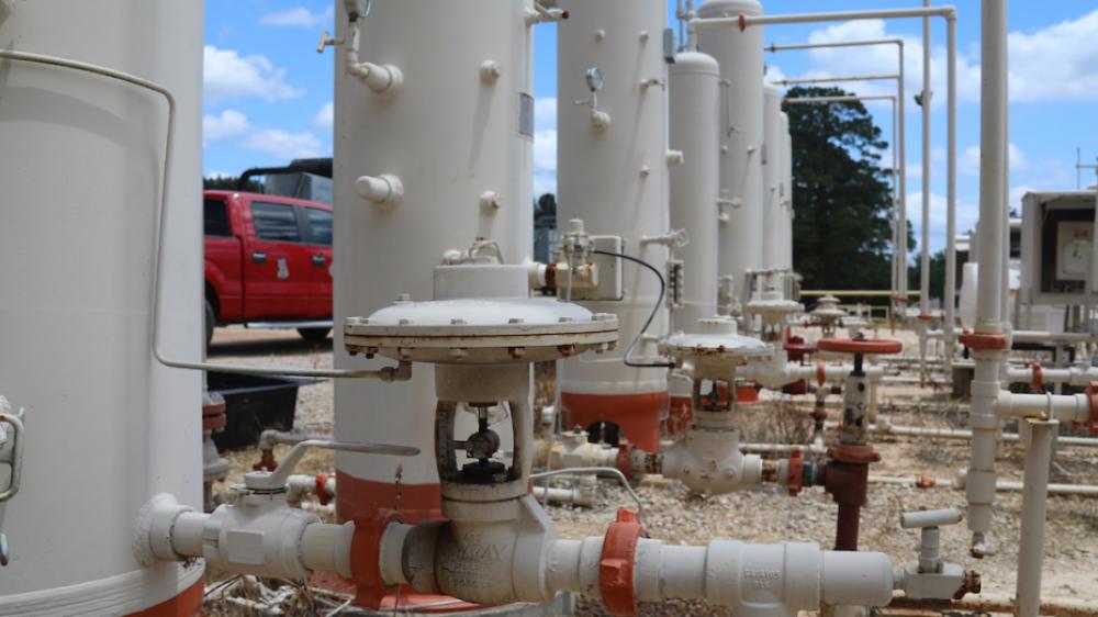 Vertical separators at a well site