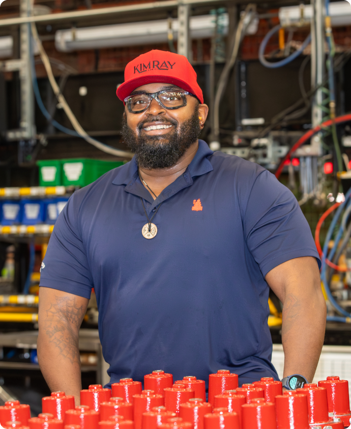 Assembly Lead Smiling with Products