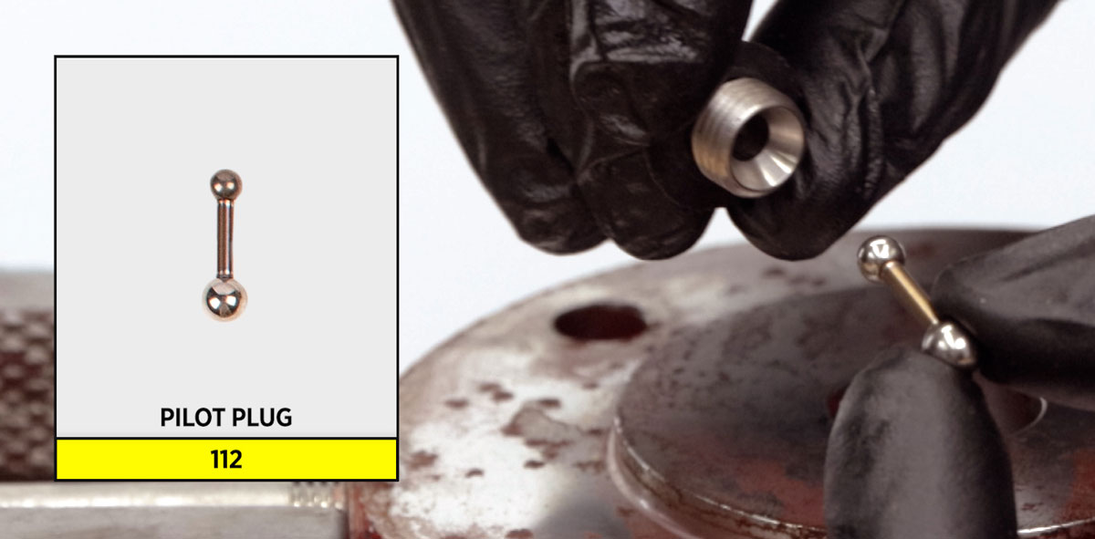 holding the small ball of the pilot plug