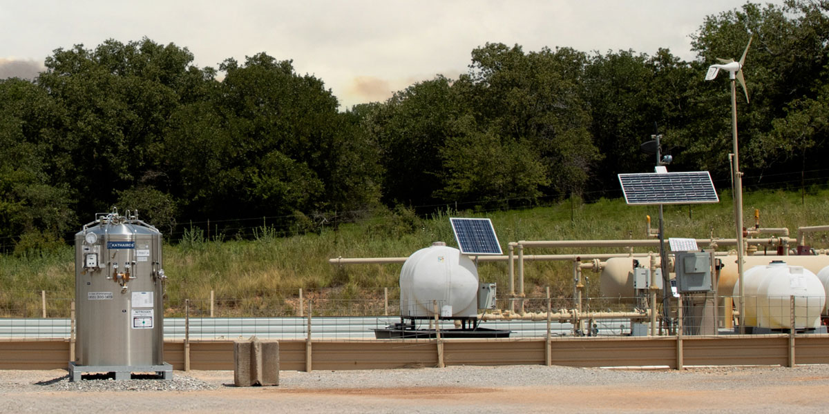 a kathairos liquid nitrogen tank on a oil site with kimray controllers