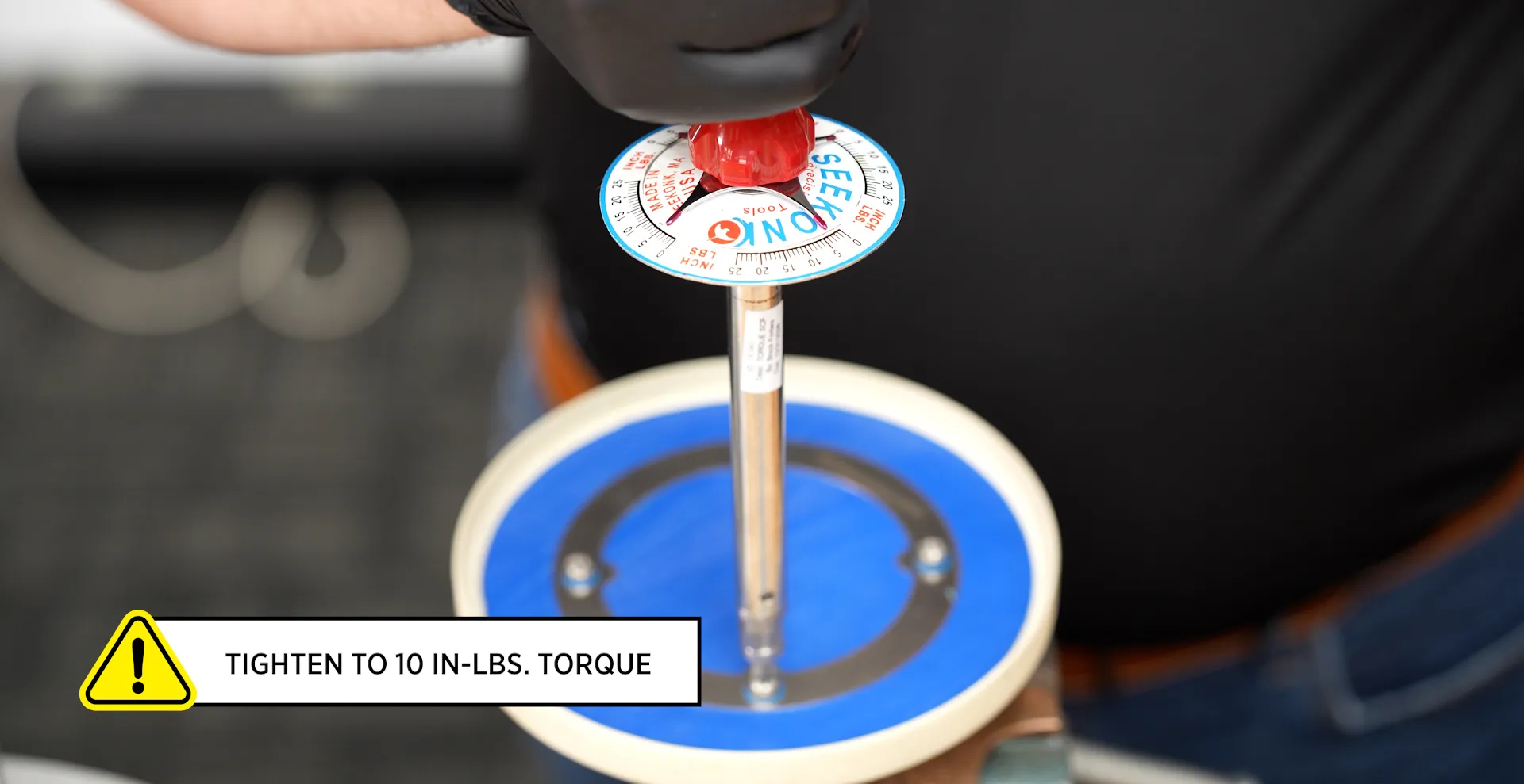tightening screws into retainer plate and pressure pallet